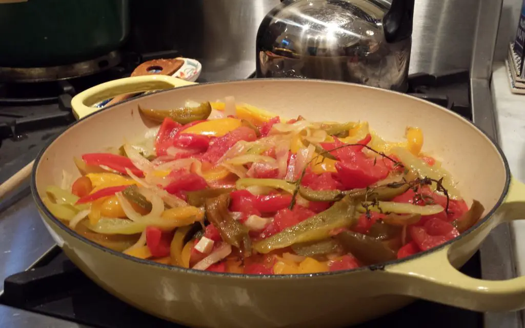 Slowly braised tomatoes, peppers, onions and piment d'espelette become Basque dish Piperade