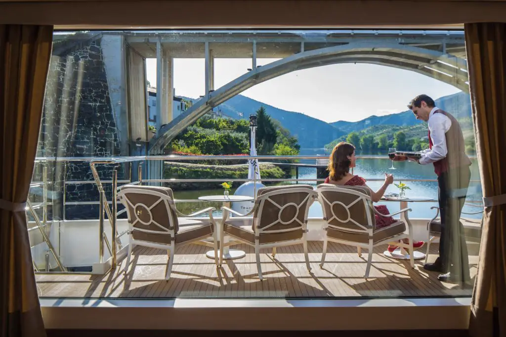 Passenger sitting on forward deck on Uniworld river cruise