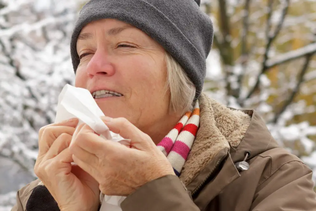 woman with dry lips and tissue in winter