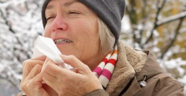 woman with dry lips and tissue in winter