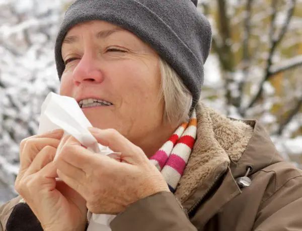 woman with dry lips and tissue in winter