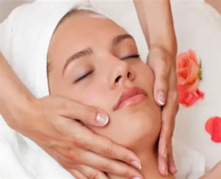 Woman receiving a facial