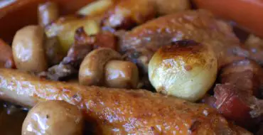 Coq au vin with mushrooms and onions