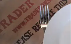 Trader Joe's paper bag, dish and fork