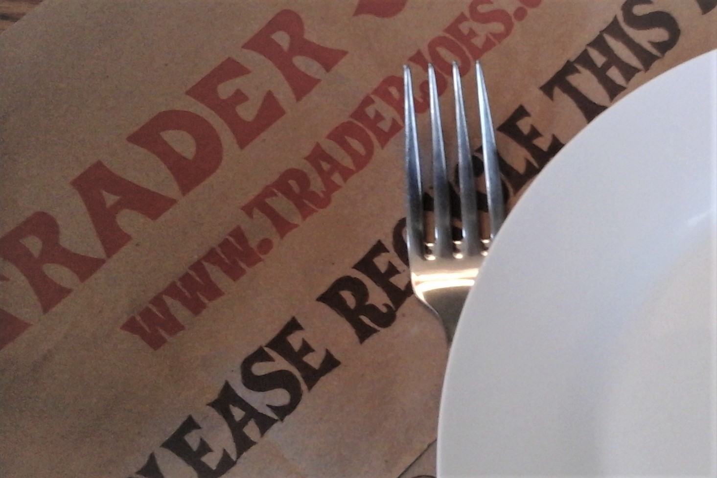 Trader Joe's paper bag, dish and fork