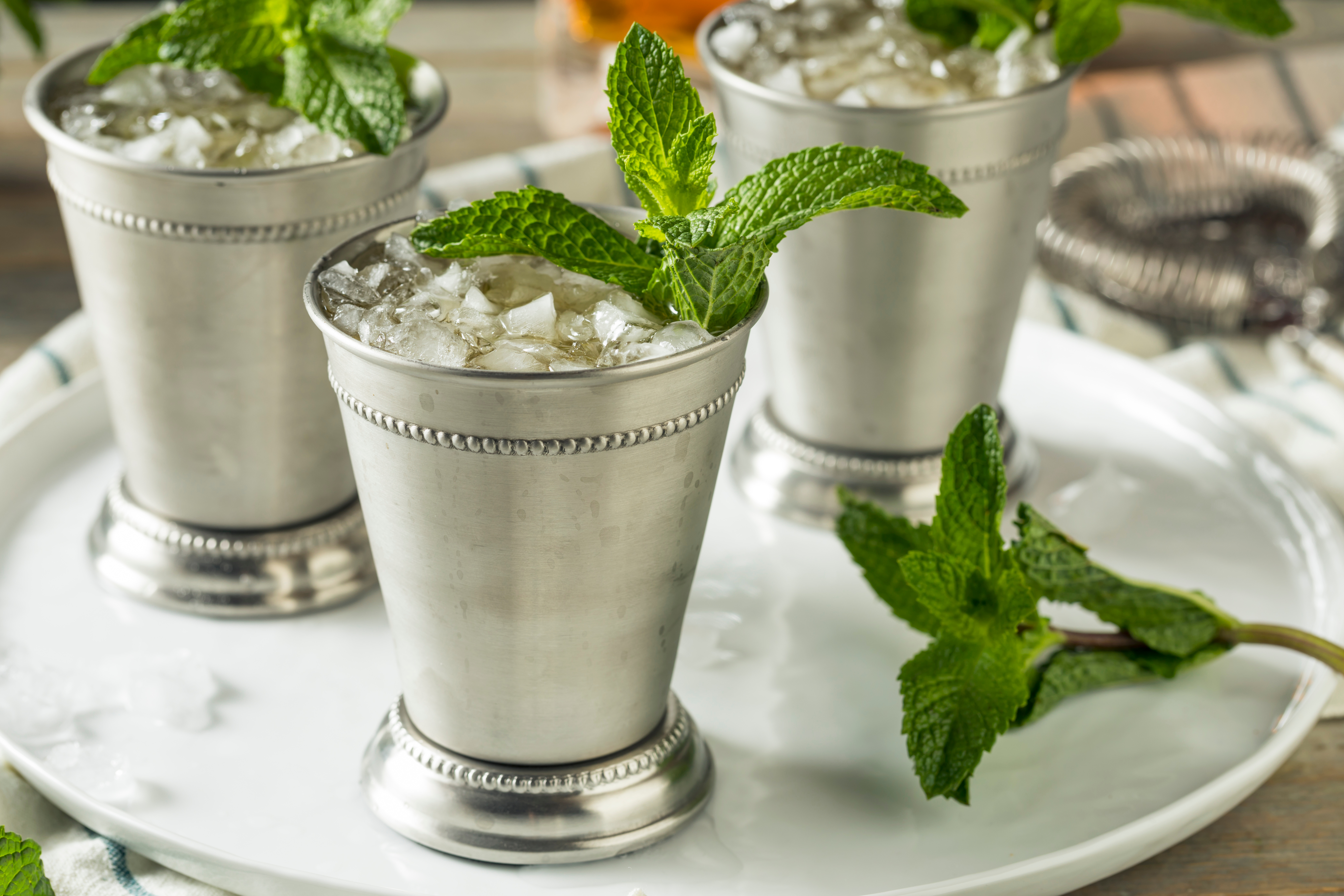 Three Mint Juleps in silver cups