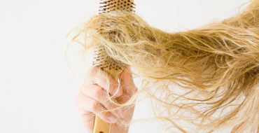 brushing tangled dry hair