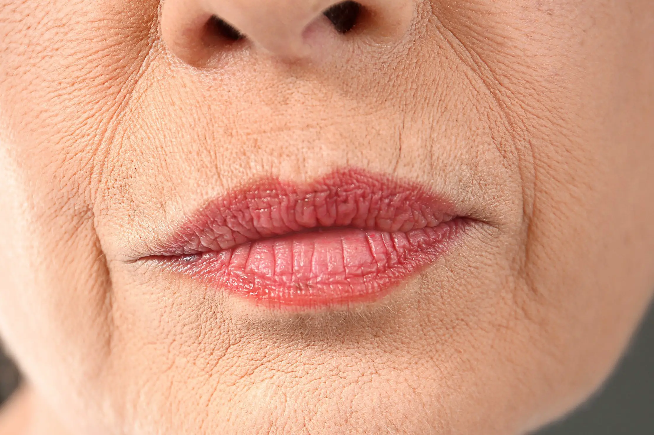 Senior woman with lines lipstick
