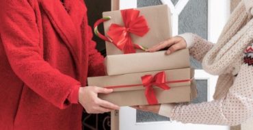 Woman presenting gift to hostess
