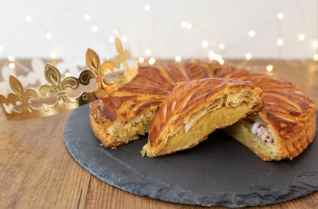 Slice of Galette des rois showing feve