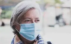 Mature woman with face mask coronavirus