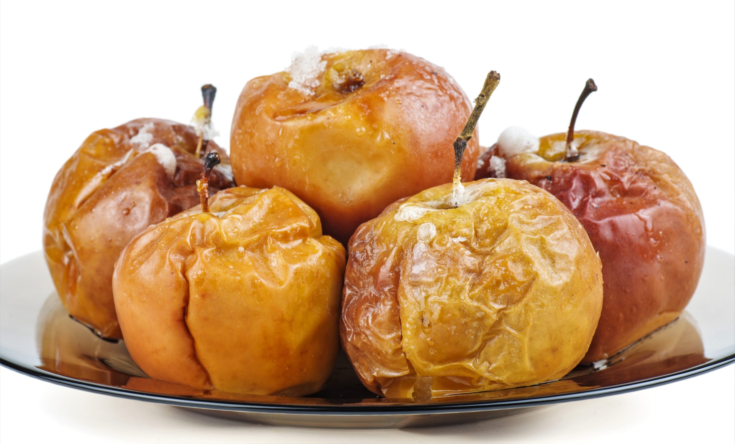 baked apples on glass platter