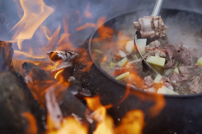 Beef stew over fire