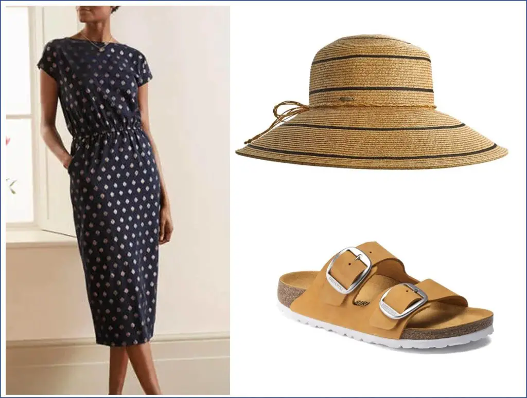 Mature woman looks stylish in Apricot Birkenstocks, Boden navy t-shirt dress and Coolibar straw hat