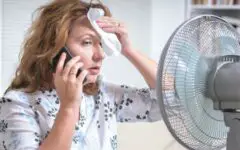 Mature woman perspiring in hot weather