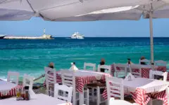 Tables in Greece by seaside