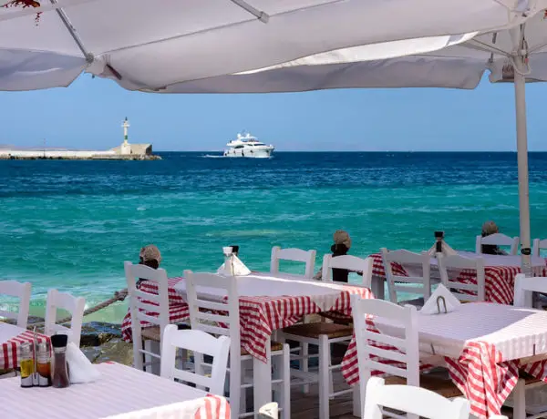Tables in Greece by seaside