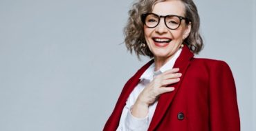 woman over 60 in red coat