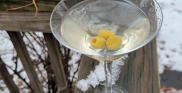 Aquavit martini in martini glass winter scene