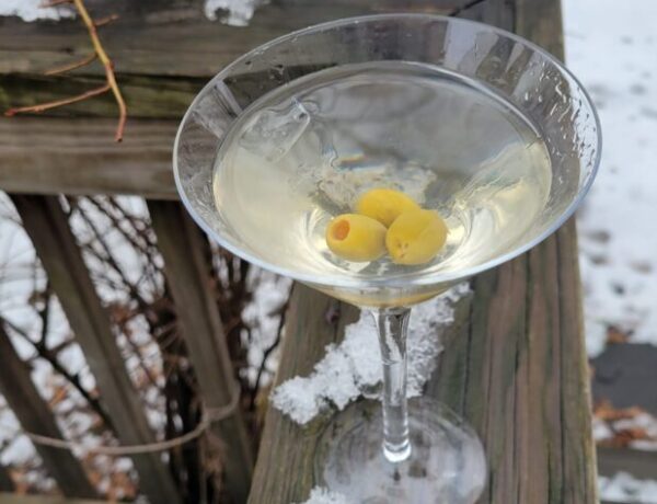 Aquavit martini in martini glass winter scene