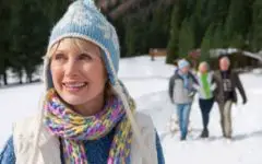 Senior Scandinavian woman walking in snow