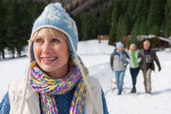 Senior Scandinavian woman walking in snow