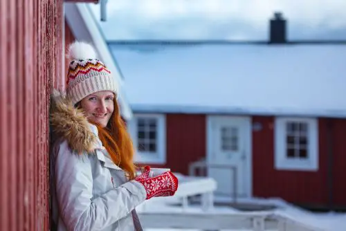 Woman winter bundled up with hot beverage