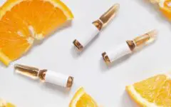 Image of serum vials and oranges