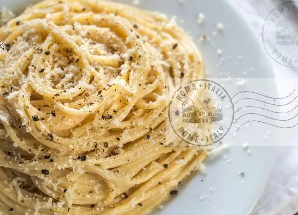 Dish of cacio e pepe pasta with postal mark