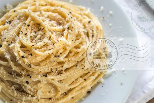 Dish of cacio e pepe pasta with postal mark