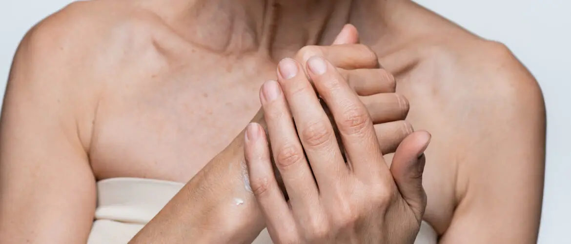 Woman rubbing moisturizer into hands