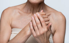 Woman rubbing moisturizer into hands