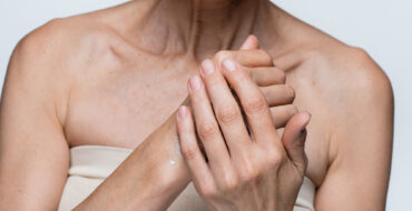 Woman rubbing moisturizer into hands
