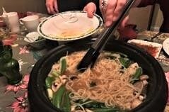 Chinese hot pot dinner finishes with noodles in broth