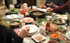 People enjoying Chinese hot pot dinner