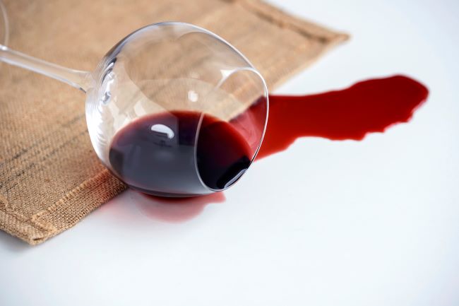 Spilled glass of red wine