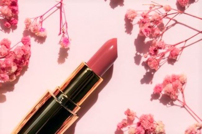Tube of spring lipstick with flowers