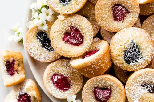 Tea cakes size of mini cupcakes with berry in center