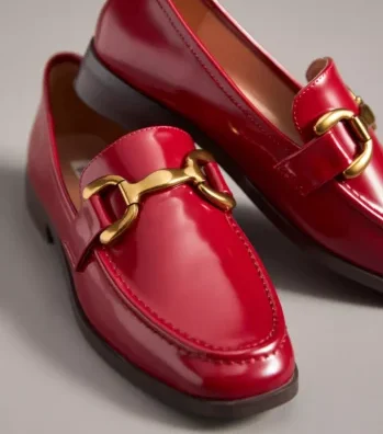 Red women's loafers with gold hardware