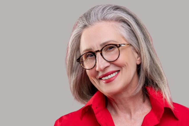 Senior woman wearing red with red lipstick