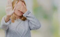 Mature woman covering face