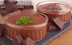 Chocolate mousse in two small white ramekins