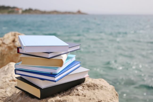 Stack of books on rock summer
