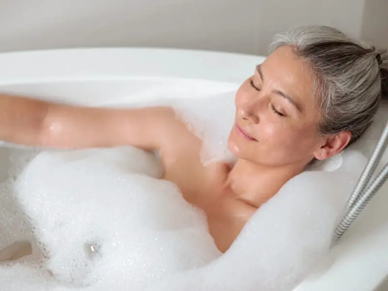 Senior woman relaxing in bath