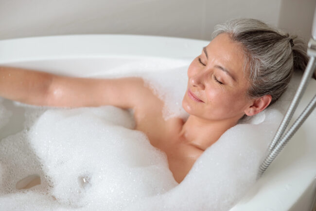 Senior woman relaxing in bath