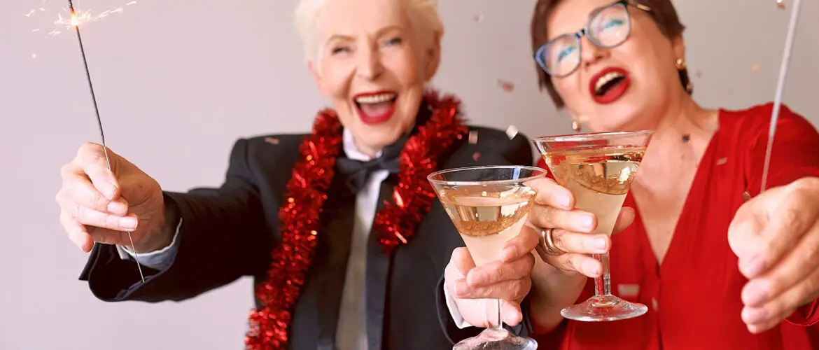 Two energetic senior women with cocktails