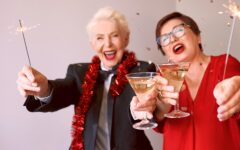 Two energetic senior women with cocktails
