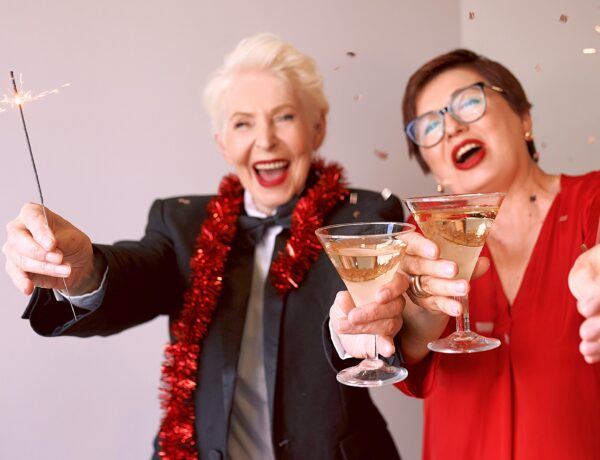 Two energetic senior women with cocktails