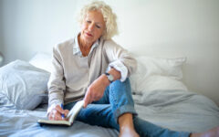 Woman in her 60s writing resolutions
